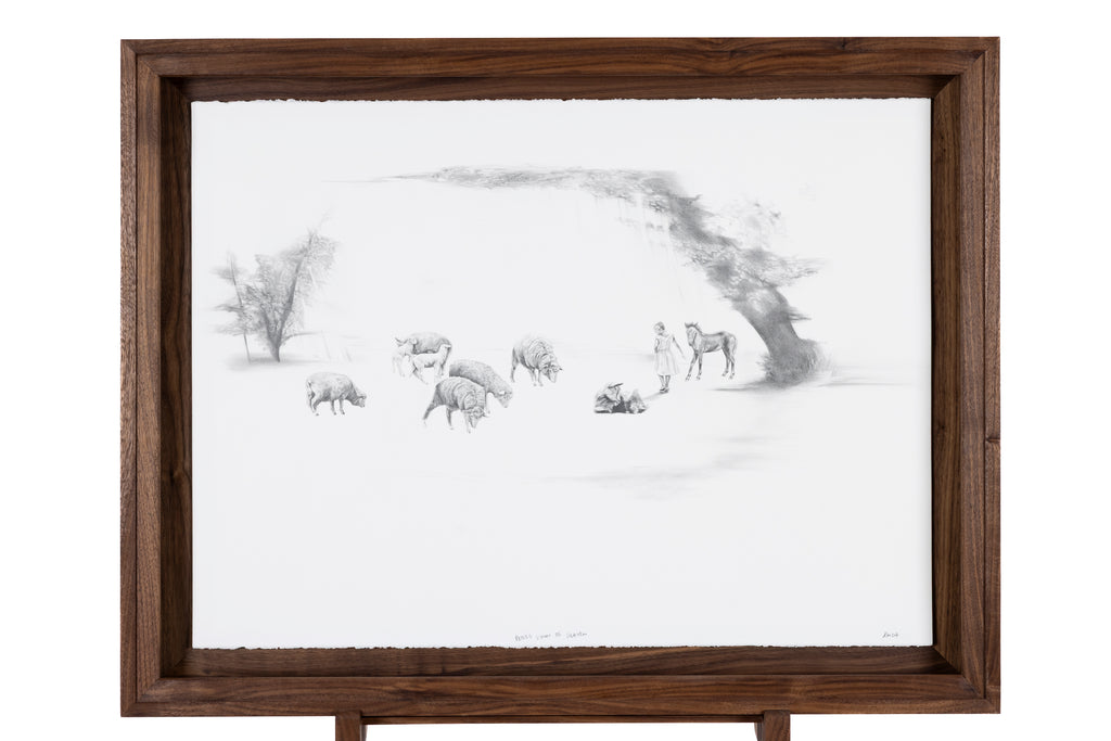 Framed black and white drawing of girl and animals in a dreamlike landscape